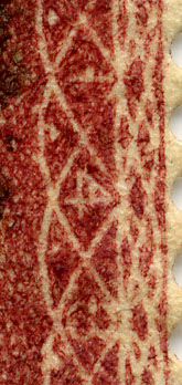 Close-up of a real Penny Red stamp showing engraved detail and plate characteristics